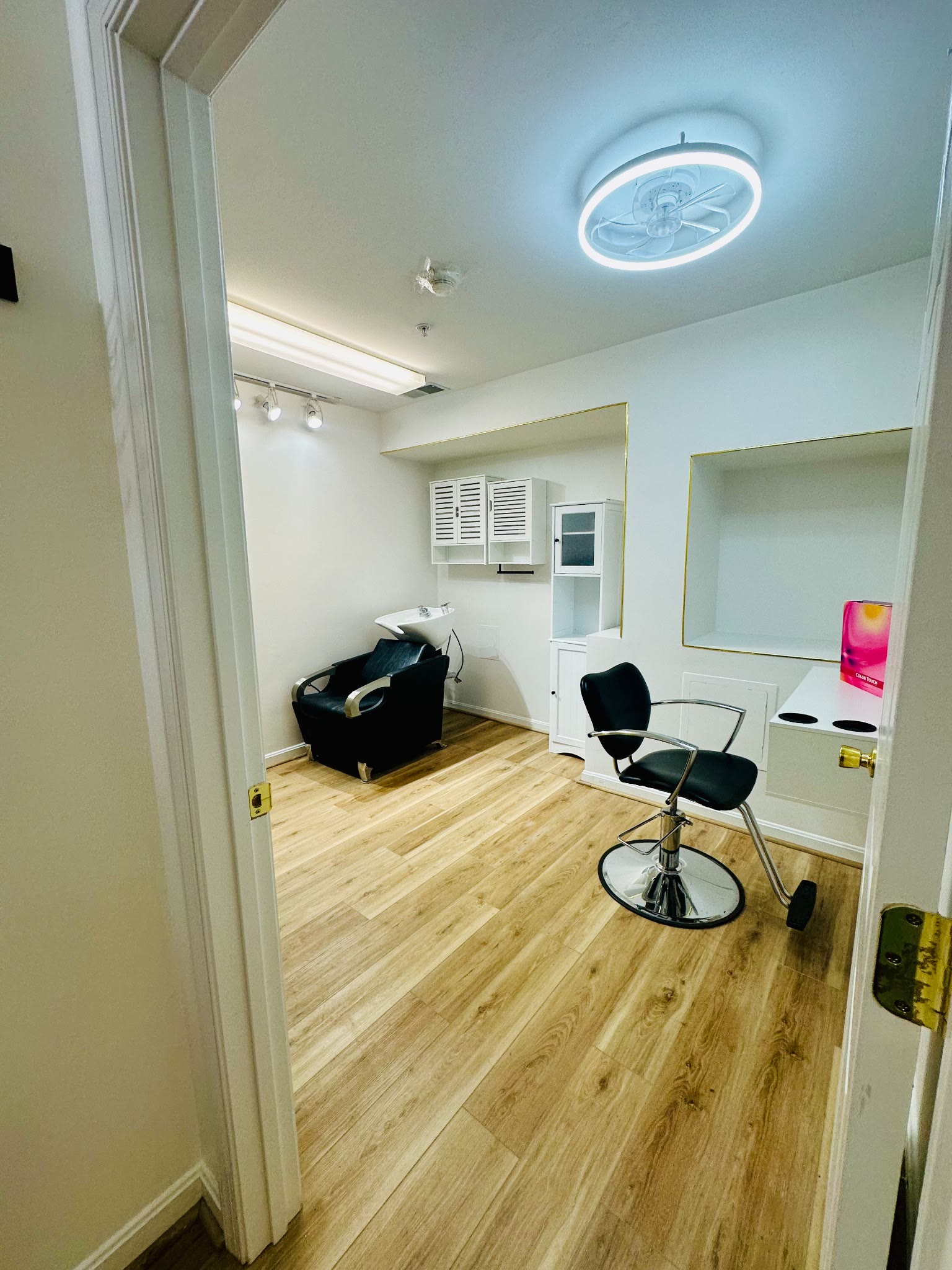 Entrance view of a private Salon Concept Suite with styling and shampoo stations
