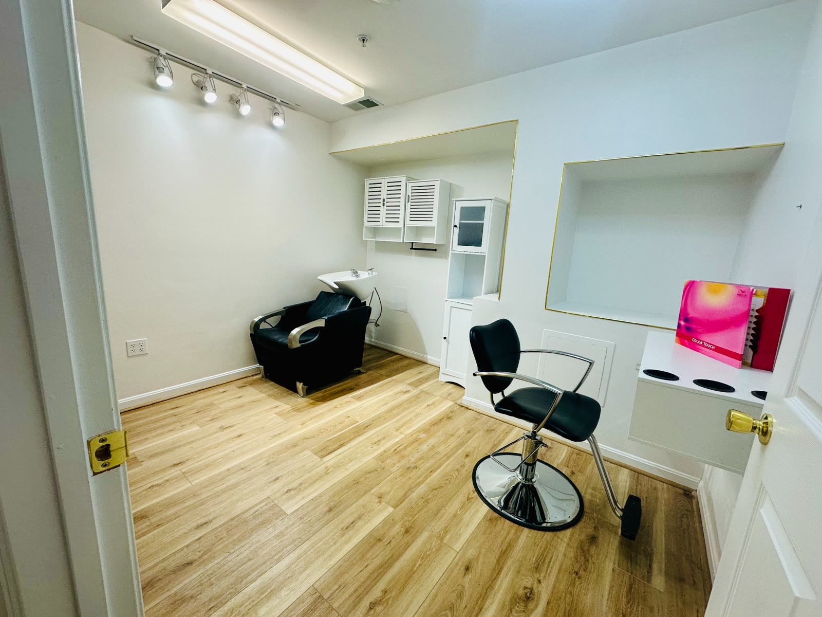 Wide view of a bright private salon suite